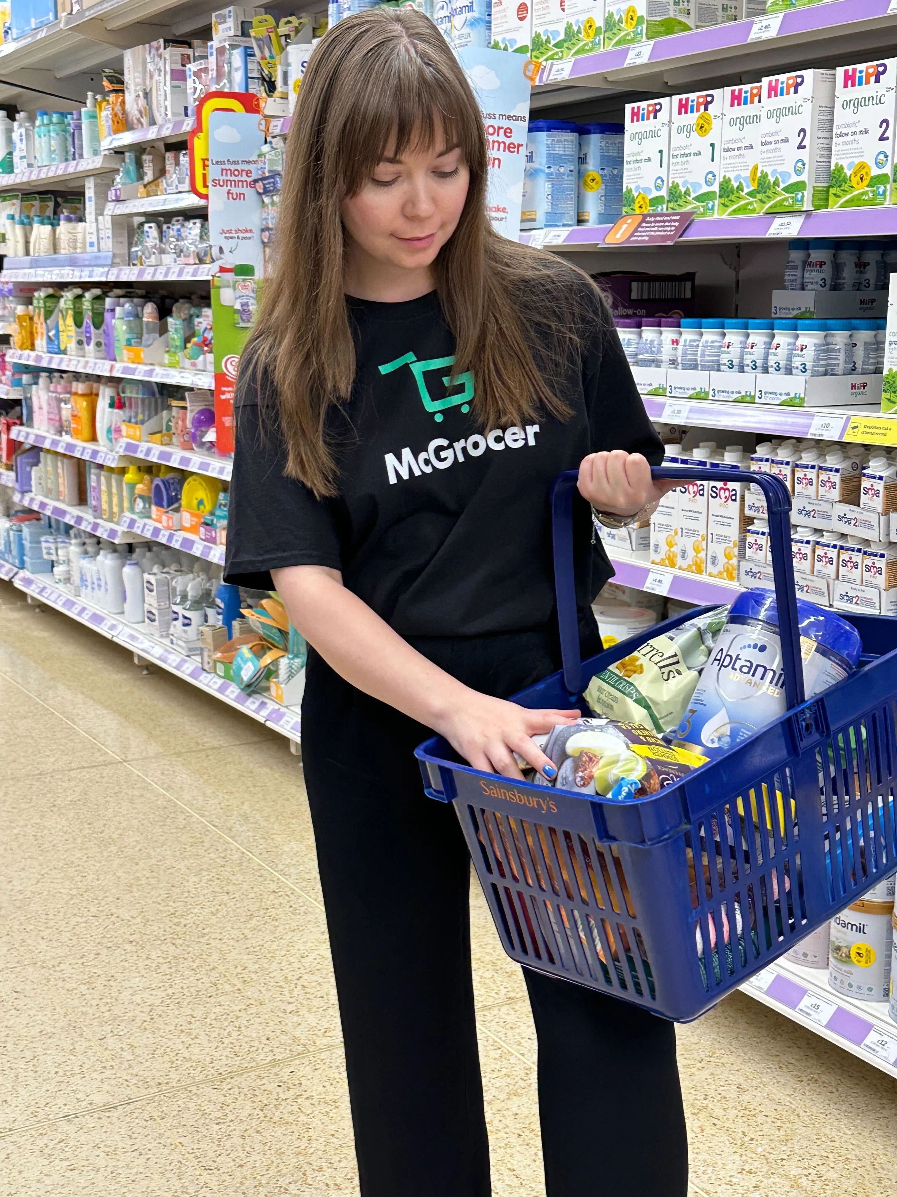 McGrocer shopper filling a basket in store